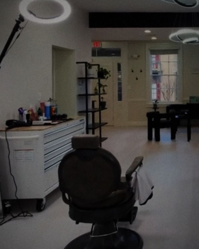 A barber chair facing the front of the studio