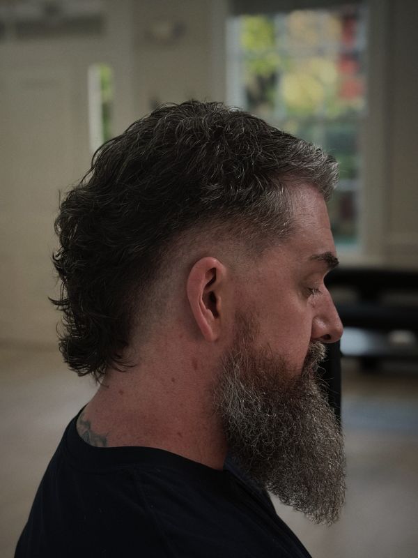 Textured modern mullet with a long beard