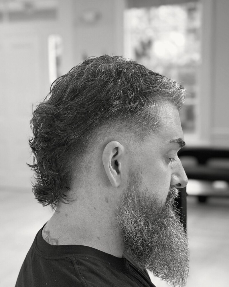 Textured modern mullet with a long beard