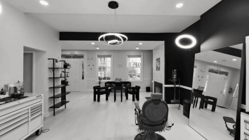 Walking into VQ’s studio: barber chairs in a row under round ring lights